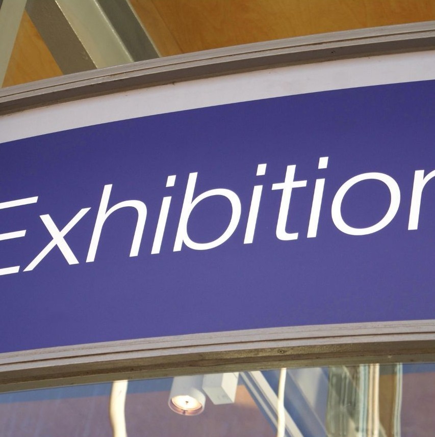 Railway Station sign - White on royal blue - "Exhibition".